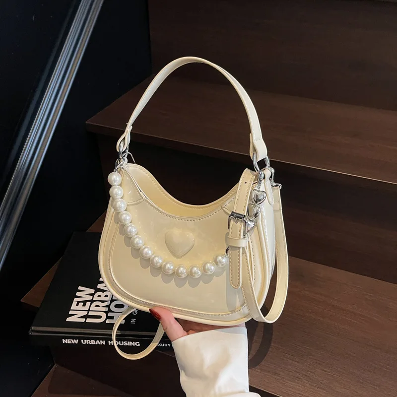 Нишевая корейская женская сумка с жемчужным полумесяцем - 2025 New Heart Минималистичная сумка через плечо для телефона через плечо
Нишевая корейская женская сумка с жемчужным полумесяцем - 2025 New Heart Минималистичная сумка через плечо для телефона через плечо