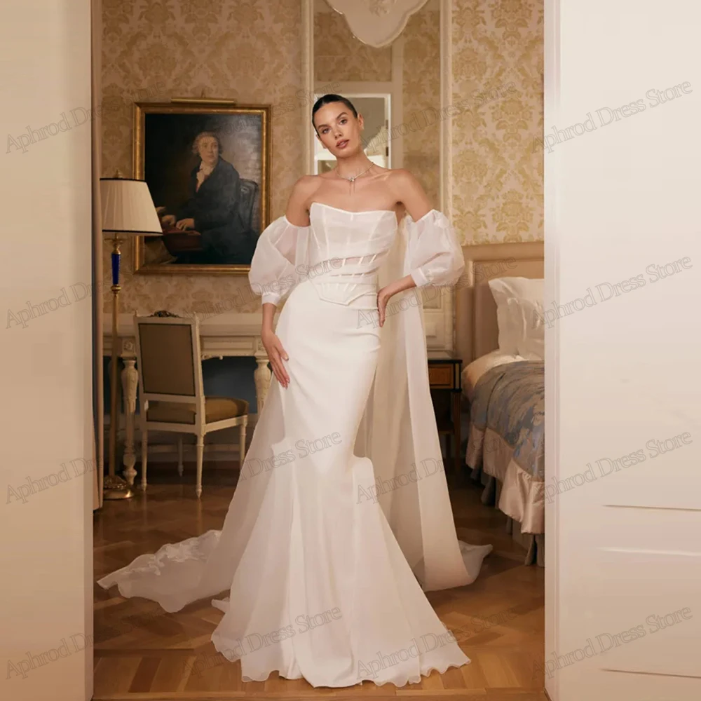 Очаровательные свадебные платья Свадебные платья из органзы Халаты с открытыми плечами Милые халаты с открытой спиной Vestidos De Novia по индивидуальному заказу 2025
Очаровательные свадебные платья Свадебные платья из органзы Халаты с открытыми плечами Милые халаты с открытой спиной Vestidos De Novia по индивидуальному заказу 2025