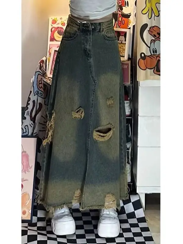Американская джинсовая юбка в стиле ретро с дырками, женская весенне-осенняя свободная длинная юбка трапециевидной формы с высокой талией большого размера
Американская джинсовая юбка в стиле ретро с дырками, женская весенне-осенняя свободная длинная юбка трапециевидной формы с высокой талией большого размера