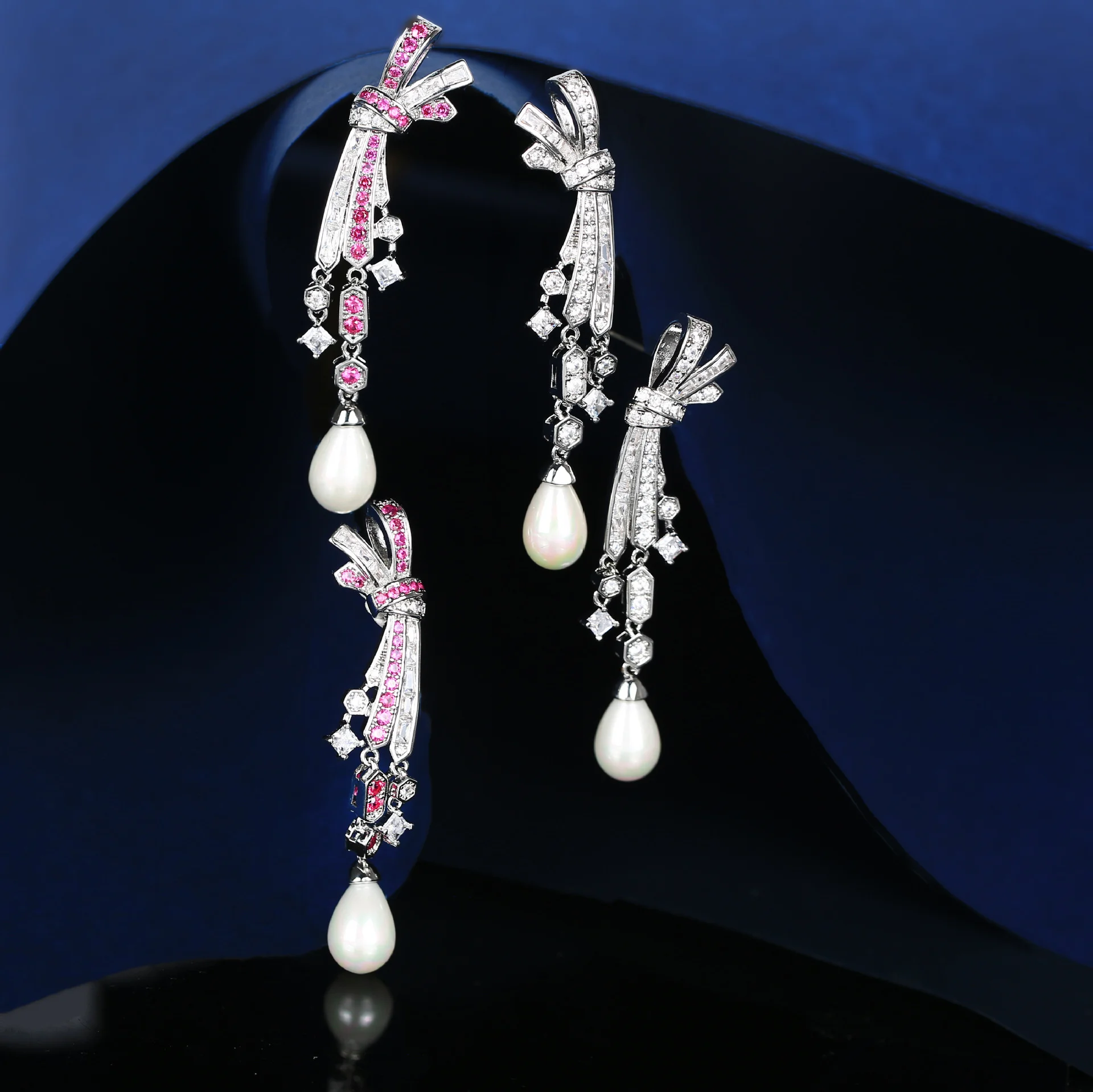925 Silver Bow Shape Pink CZ Pearl Drop Earrings, Sparkling Gemstone Dangle, Luxury Bridal Jewelry for Women
925 Silver Bow Shape Pink CZ Pearl Drop Earrings, Sparkling Gemstone Dangle, Luxury Bridal Jewelry for Women