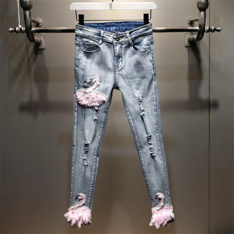 New elastic light blue denim pencil pants women's high waist swan embroidery women's pants
New elastic light blue denim pencil pants women's high waist swan embroidery women's pants