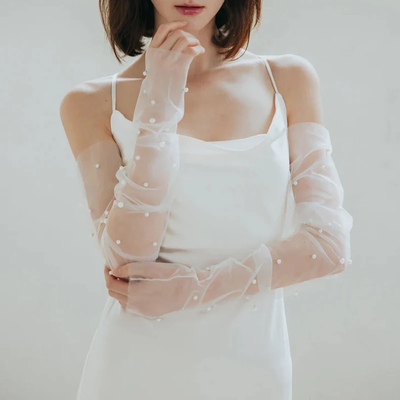 Elegant Mesh Pearl Long Fingerless Tulle Gloves Brides Thin Transparent Detachable Arm Sleeves Wedding Dress Decorative Accessor
Elegant Mesh Pearl Long Fingerless Tulle Gloves Brides Thin Transparent Detachable Arm Sleeves Wedding Dress Decorative Accessor