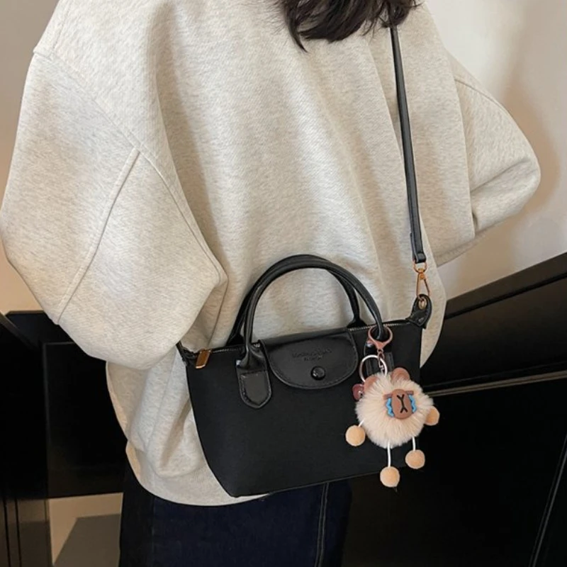 Мини-кошелек для монет, женский новый стиль 2025, высококачественная и универсальная сумка через плечо, суперпопулярная ручная сумка для пельменей 
Мини-кошелек для монет, женский новый стиль 2025, высококачественная и универсальная сумка через плечо, суперпопулярная ручная сумка для пельменей