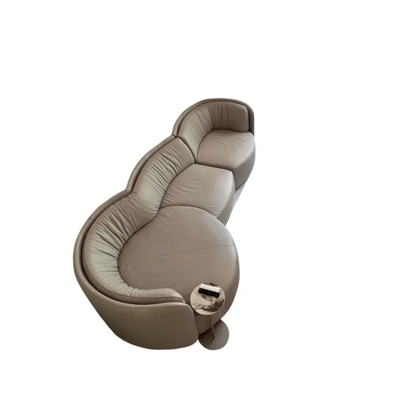 Designer curved round small apartment leather large flat three-person living room sofa
Designer curved round small apartment leather large flat three-person living room sofa