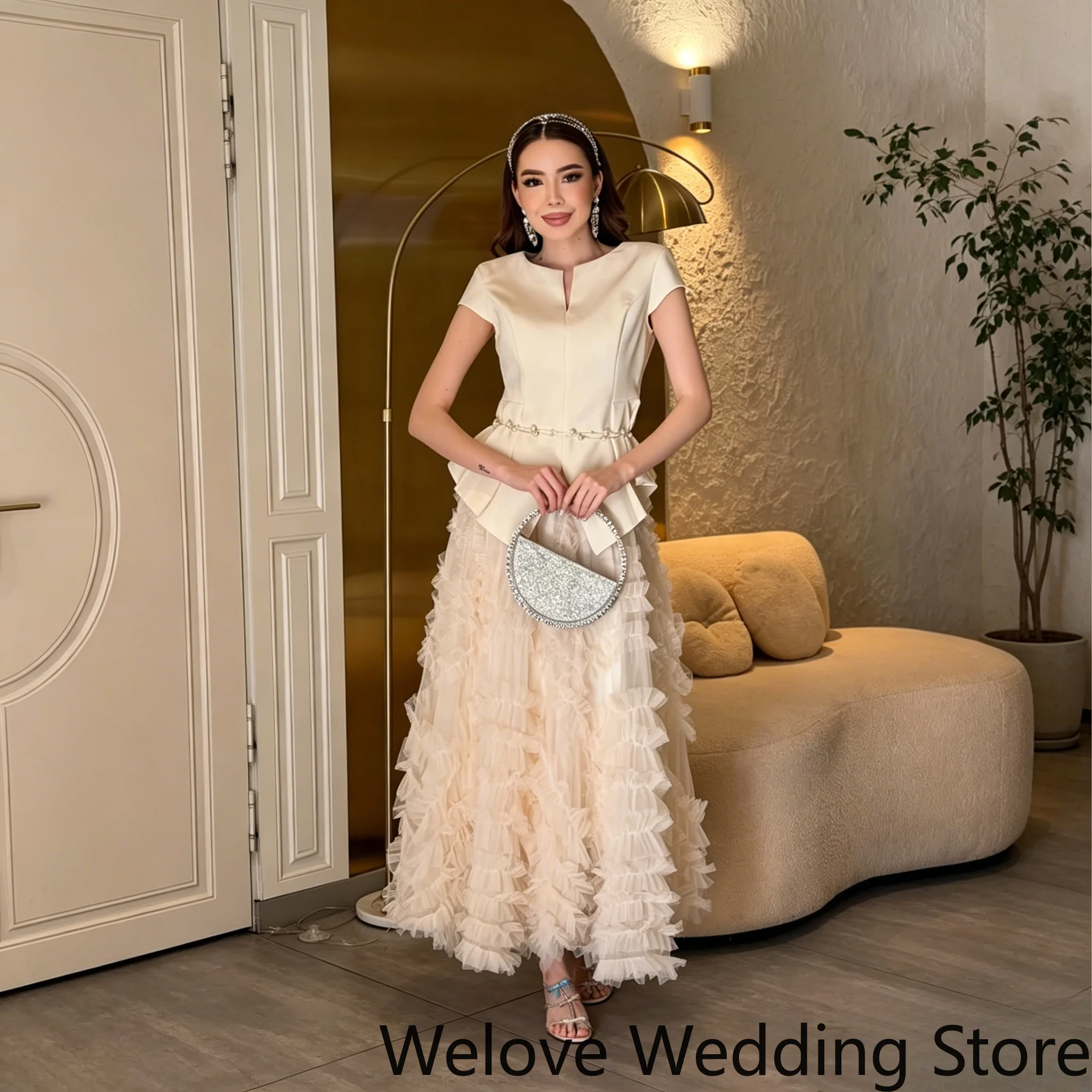Cream Formal Two‑Piece Outfit with Notched Neck Short‑Sleeve Peplum Tailored Top Voluminous Multi‑Layered Ruffle Tulle
Cream Formal Two‑Piece Outfit with Notched Neck Short‑Sleeve Peplum Tailored Top Voluminous Multi‑Layered Ruffle Tulle