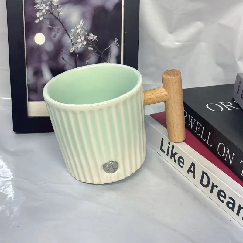 Starbucks 450ml Mint Green Ceramic Mug with Wooden Handle, Vertical Ribbed Coffee Cup
Starbucks 450ml Mint Green Ceramic Mug with Wooden Handle, Vertical Ribbed Coffee Cup