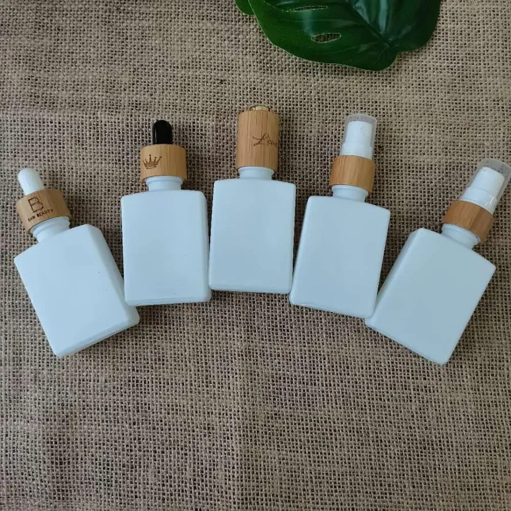 White square glass dropper bottle Eco-friendly bamboo cap Cosmetic essential oilaromatherapyContainerpackaging,OilPipetteBottles
White square glass dropper bottle Eco-friendly bamboo cap Cosmetic essential oilaromatherapyContainerpackaging,OilPipetteBottles