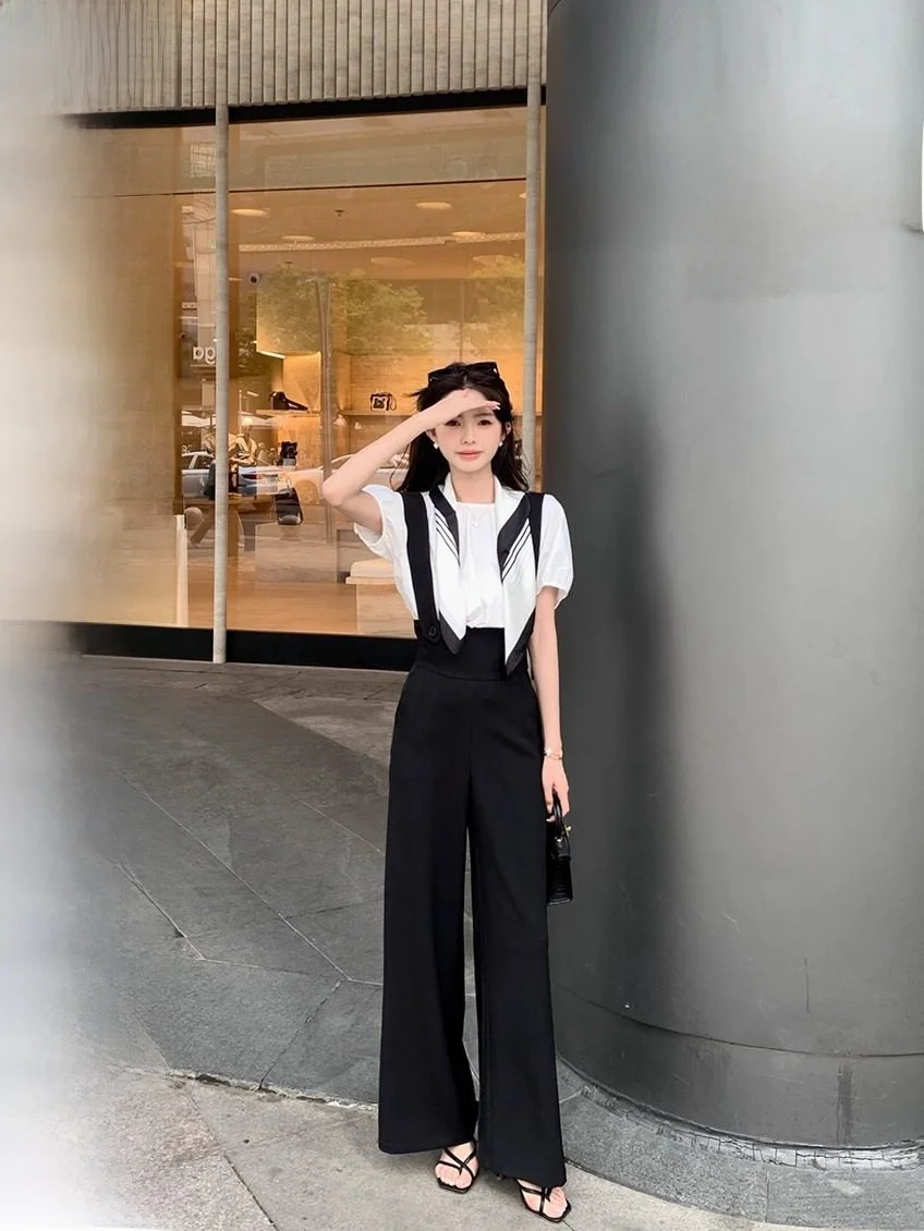 Летний повседневный комплект для женщин: футболка с коротким рукавом и бантом, брюки с широкими штанинами из полиэстера, шелковый платок, брюки с высокой талией.
Летний повседневный комплект для женщин: футболка с коротким рукавом и бантом, брюки с широкими штанинами из полиэстера, шелковый платок, брюки с высокой талией.