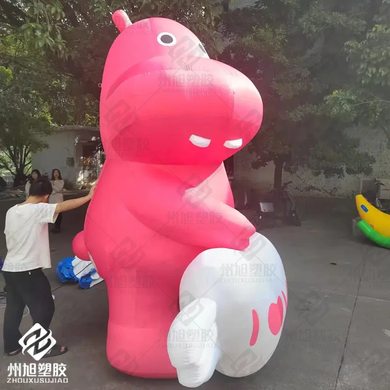 Cartoon inflatable hippo holding white heart with horned wings air model pink animal mascot event mall advertising decoration
Cartoon inflatable hippo holding white heart with horned wings air model pink animal mascot event mall advertising decoration