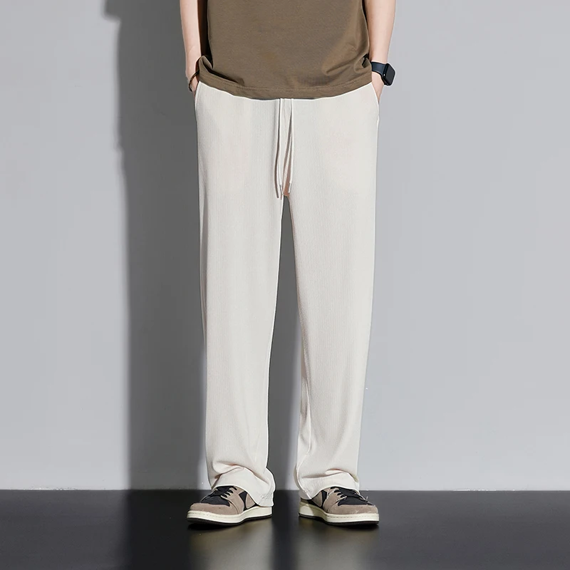 Новые свободные модные прямые брюки, повседневные брюки с эластичной резинкой на талии и шнурком, спортивные мужские однотонные мужские спортивные штаны, весна-осень, широкие штанины
Новые свободные модные прямые брюки, повседневные брюки с эластичной резинкой на талии и шнурком, спортивные мужские однотонные мужские спортивные штаны, весна-осень, широкие штанины