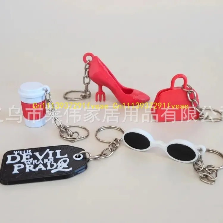 The Devil Wears Pa-Prada-S 2 Movie Keychain with Sunglasses Coffee Cup & High Heels Charms Bag Accessory for Fans
The Devil Wears Pa-Prada-S 2 Movie Keychain with Sunglasses Coffee Cup & High Heels Charms Bag Accessory for Fans