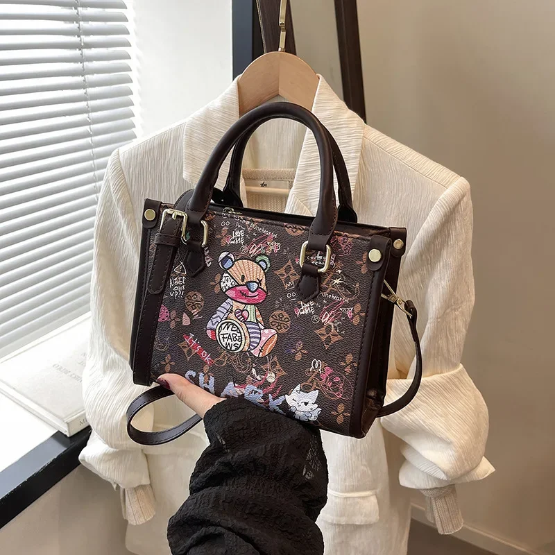 2025newCute Bear Graffiti Crossbody Bag for Women - Large Capacity Stylish Simple Design Adjustable StrapVersatile Business
2025newCute Bear Graffiti Crossbody Bag for Women - Large Capacity Stylish Simple Design Adjustable StrapVersatile Business