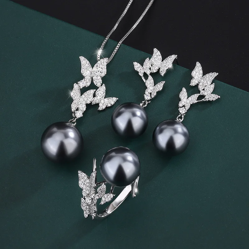 New European and American style vintage butterfly-shaped gray pearl elegant women's pendant necklace, earrings, and ring set
New European and American style vintage butterfly-shaped gray pearl elegant women's pendant necklace, earrings, and ring set