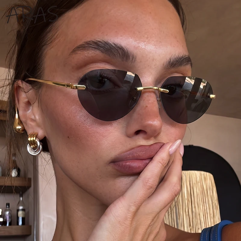Sexy Rimless Oval Sunglasses Women 2026 Luxury Designer Teardrop Pendant Metal Temple Sun Glasses Retro Y2K Punk Outdoor Eyewear
Sexy Rimless Oval Sunglasses Women 2026 Luxury Designer Teardrop Pendant Metal Temple Sun Glasses Retro Y2K Punk Outdoor Eyewear
