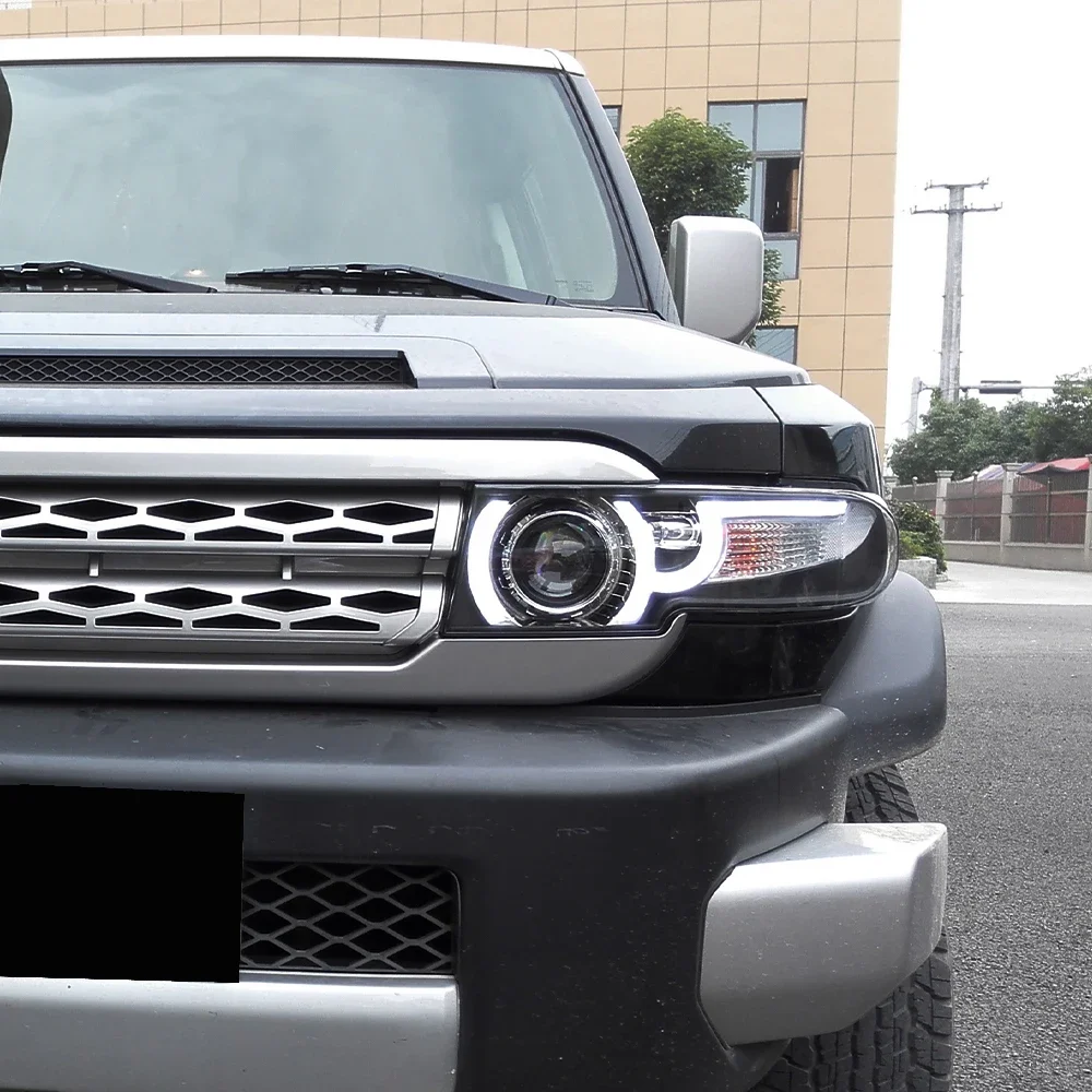 Передние фары автомобиля в сборе для Toyota FJ Cruiser 2007-2017, светодиодные автомобильные фары, обновление Land Rover, дизайн, аксессуары для бифокальных линз
Передние фары автомобиля в сборе для Toyota FJ Cruiser 2007-2017, светодиодные автомобильные фары, обновление Land Rover, дизайн, аксессуары для бифокальных линз