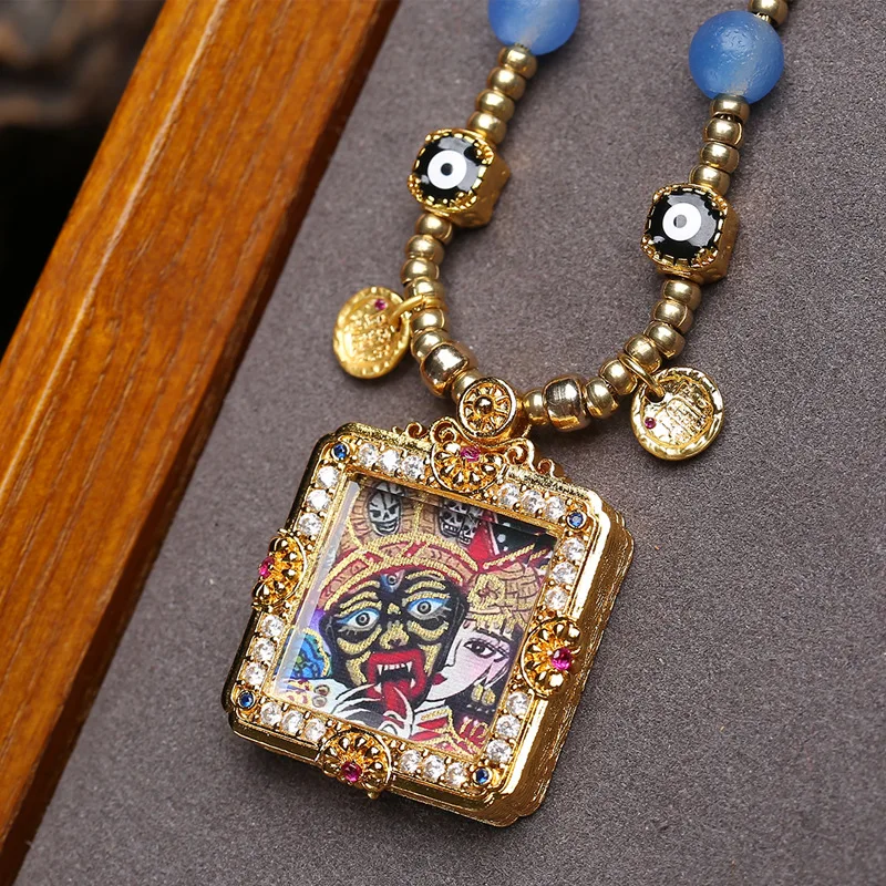 Tibetan-style Hand-painted Thangka Zhakiramu: Past and Present Pendant Collar Necklace with Agate Accents
Tibetan-style Hand-painted Thangka Zhakiramu: Past and Present Pendant Collar Necklace with Agate Accents
