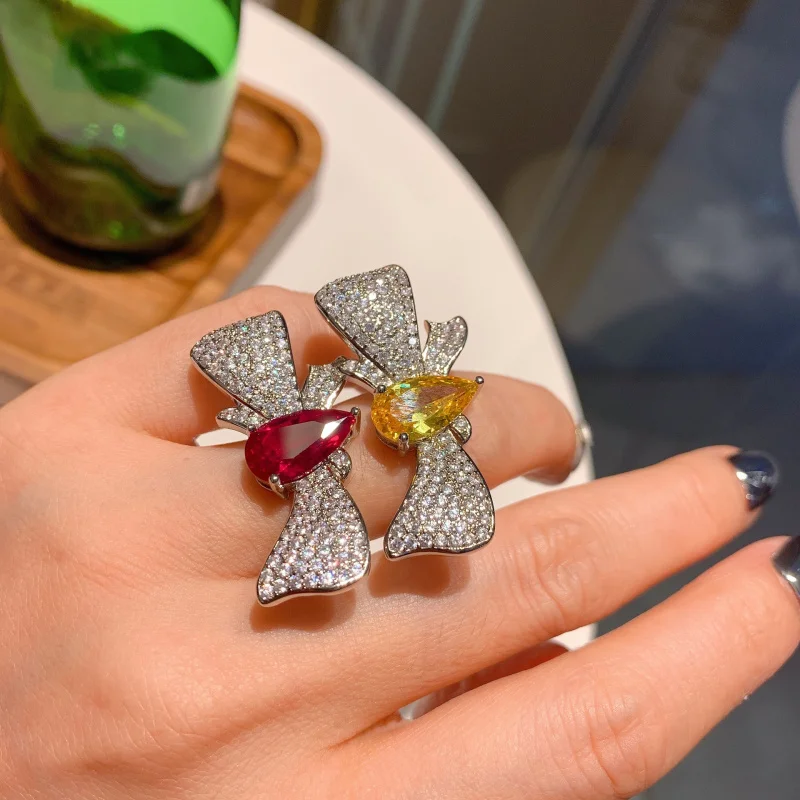 European and American fashion teardrop-shaped ruby and yellow gemstone elegant ring, bow ring wholesale for women
European and American fashion teardrop-shaped ruby and yellow gemstone elegant ring, bow ring wholesale for women