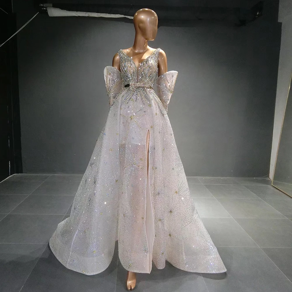 2023 New Bling Silver White Luxury Dubai Evening Dresses with Sleeves A-Line Side Slit Elegant Women Wedding Party Gown
2023 New Bling Silver White Luxury Dubai Evening Dresses with Sleeves A-Line Side Slit Elegant Women Wedding Party Gown