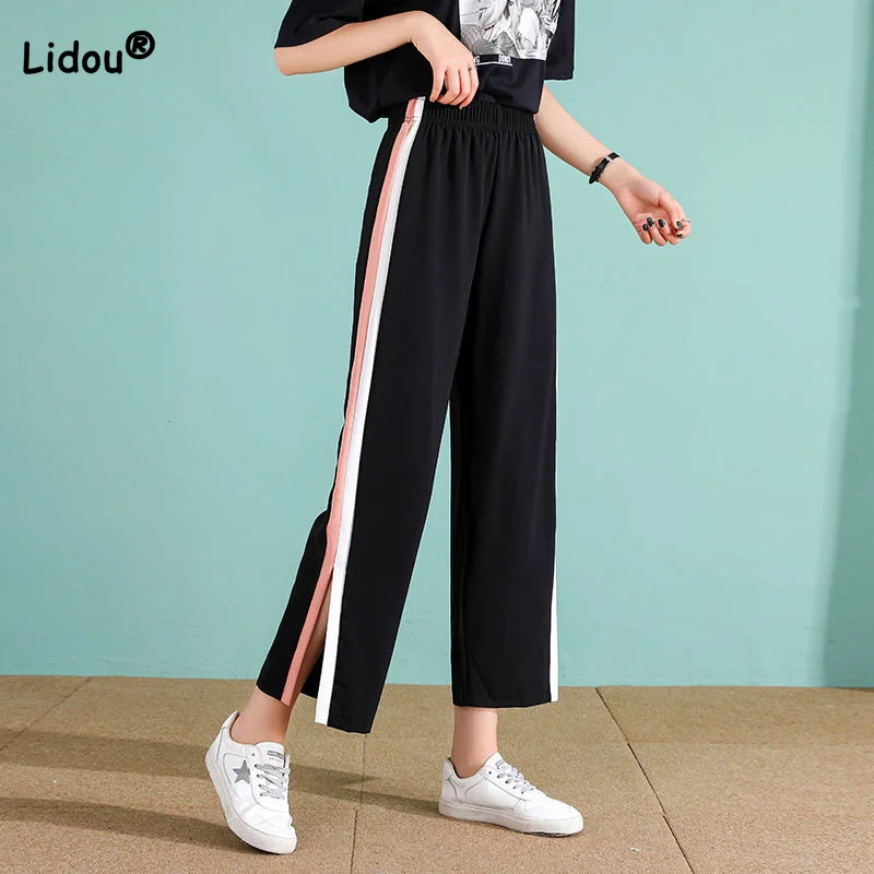 Casual Elastic High Waist Drape Patchwork Pockets Black Split Sports Pants Colored Side Stripes Wide Leg Nine Points Trousers
Casual Elastic High Waist Drape Patchwork Pockets Black Split Sports Pants Colored Side Stripes Wide Leg Nine Points Trousers