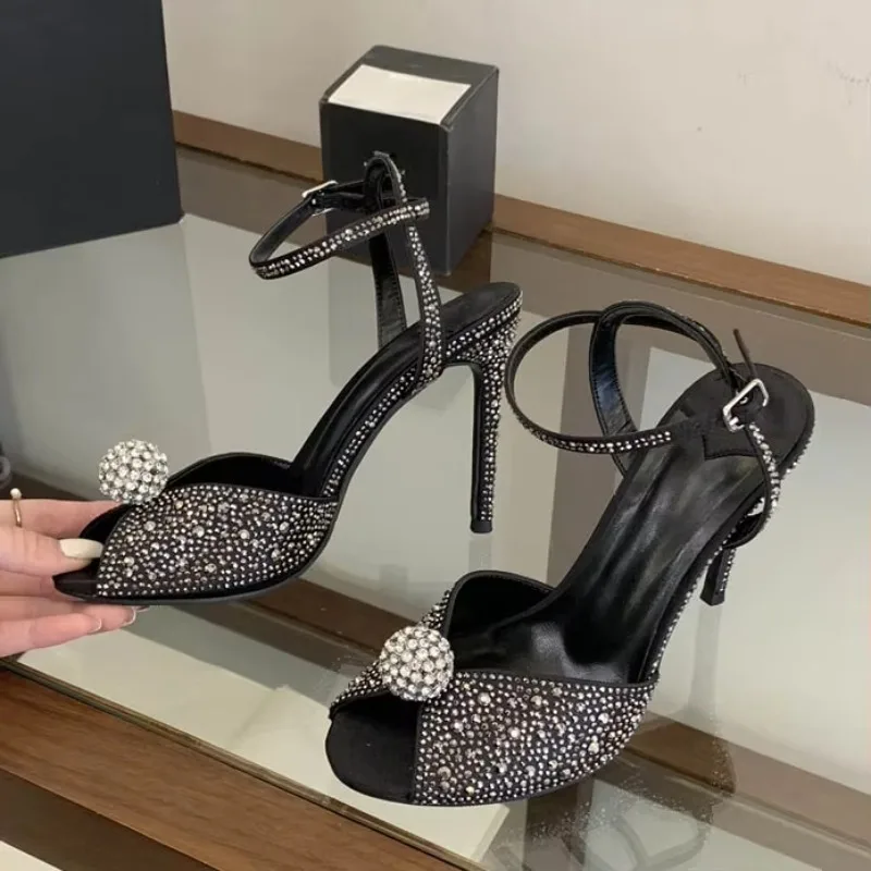 Aneikeh 2026 New Women Rhinestone High Heel Sandals Crystal Ball Ankle Strap Thin Heels Black Peep Toe Party Wedding Shoes
Aneikeh 2026 New Women Rhinestone High Heel Sandals Crystal Ball Ankle Strap Thin Heels Black Peep Toe Party Wedding Shoes