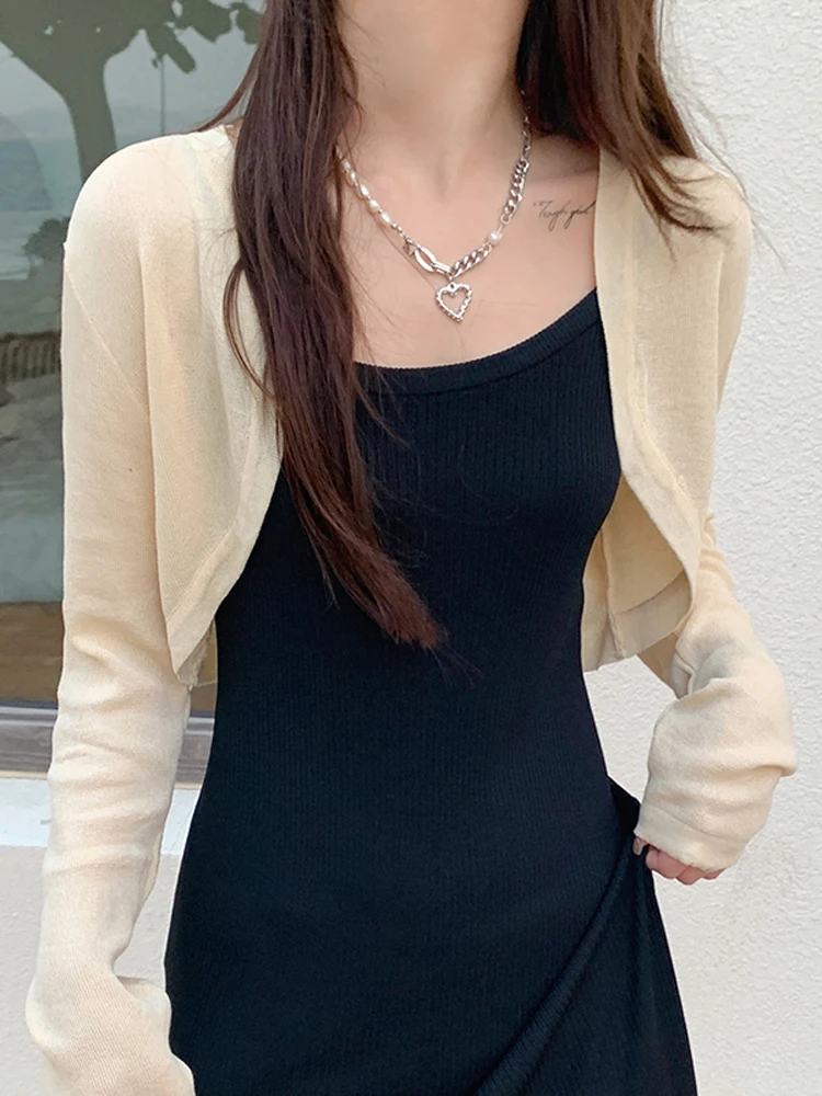 Ice Silk Knitted Cardigan Women's Thin Summer Shawl Shoulder Baring Top Strap Dress Outer Covering Coat Casual Loose Fit Long...
Ice Silk Knitted Cardigan Women's Thin Summer Shawl Shoulder Baring Top Strap Dress Outer Covering Coat Casual Loose Fit Long...