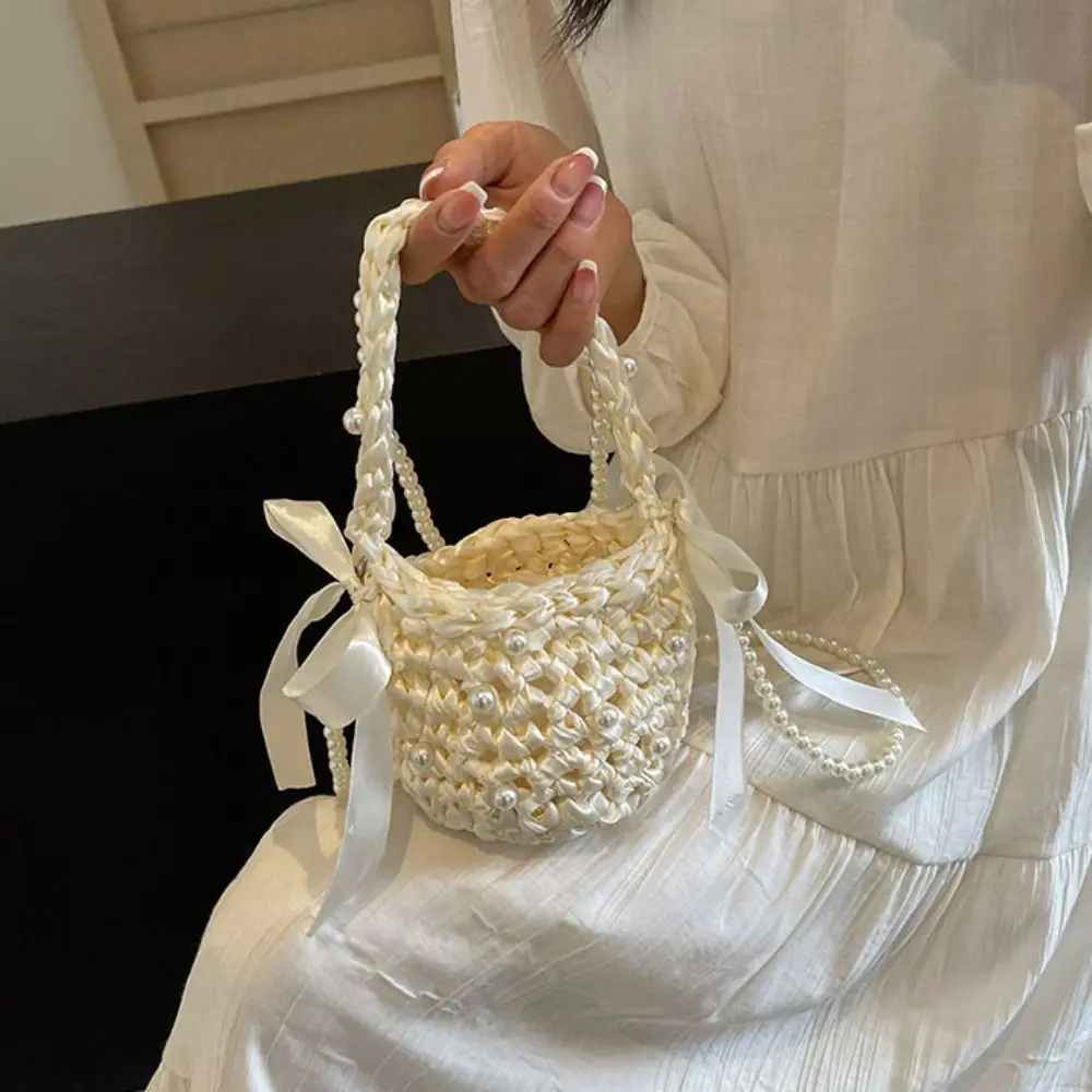 Sweet Bow Weave Bag Solid Color Hollow Pearl Shoulder Bag Bohemian Style Large Capacity Beach Handbag Holiday
Sweet Bow Weave Bag Solid Color Hollow Pearl Shoulder Bag Bohemian Style Large Capacity Beach Handbag Holiday