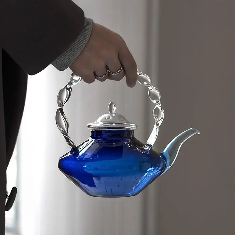 Blue glass teapot, heat-resistant and heatable, Japanese style simple twisted pattern handle teapot, heat-resistant glass teapot
Blue glass teapot, heat-resistant and heatable, Japanese style simple twisted pattern handle teapot, heat-resistant glass teapot
