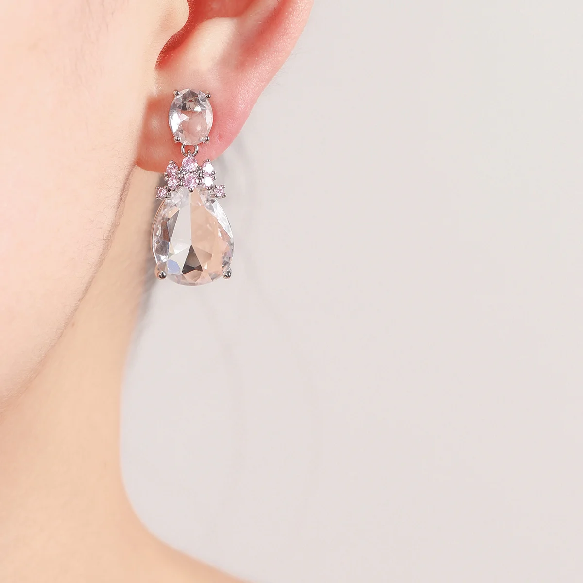 Silver Tone Drop Earrings with Large Clear Teardrop Gemstone & Pink Rhinestone Accents for Women Evening Party Wear
Silver Tone Drop Earrings with Large Clear Teardrop Gemstone & Pink Rhinestone Accents for Women Evening Party Wear