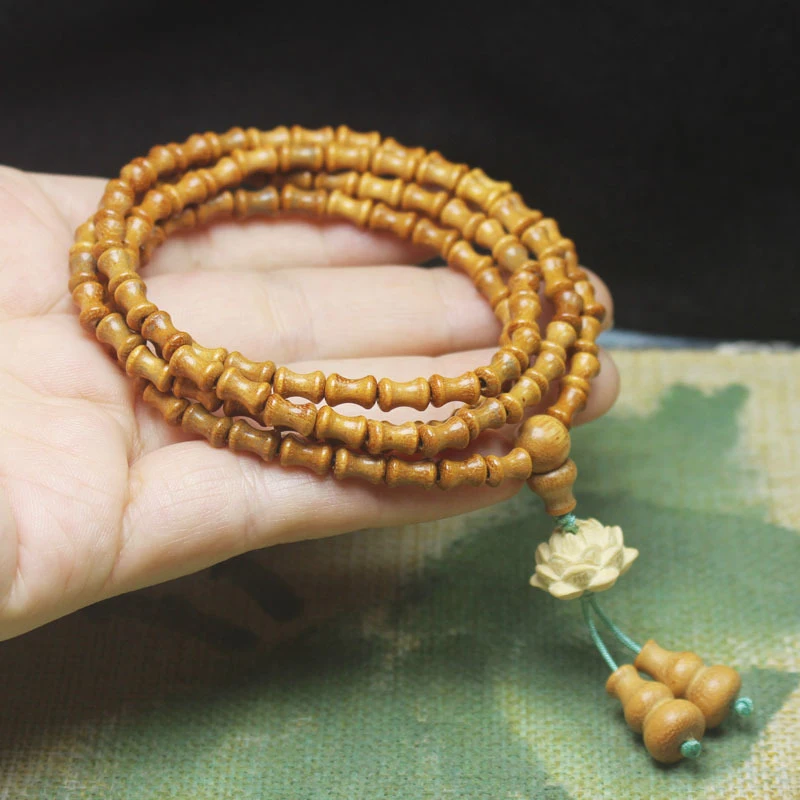 Sandalwood bamboo knot multi-loop Buddhist bracelet, wooden lotus design, unisex fashion hand accessory, prayer bead jewelr
Sandalwood bamboo knot multi-loop Buddhist bracelet, wooden lotus design, unisex fashion hand accessory, prayer bead jewelr