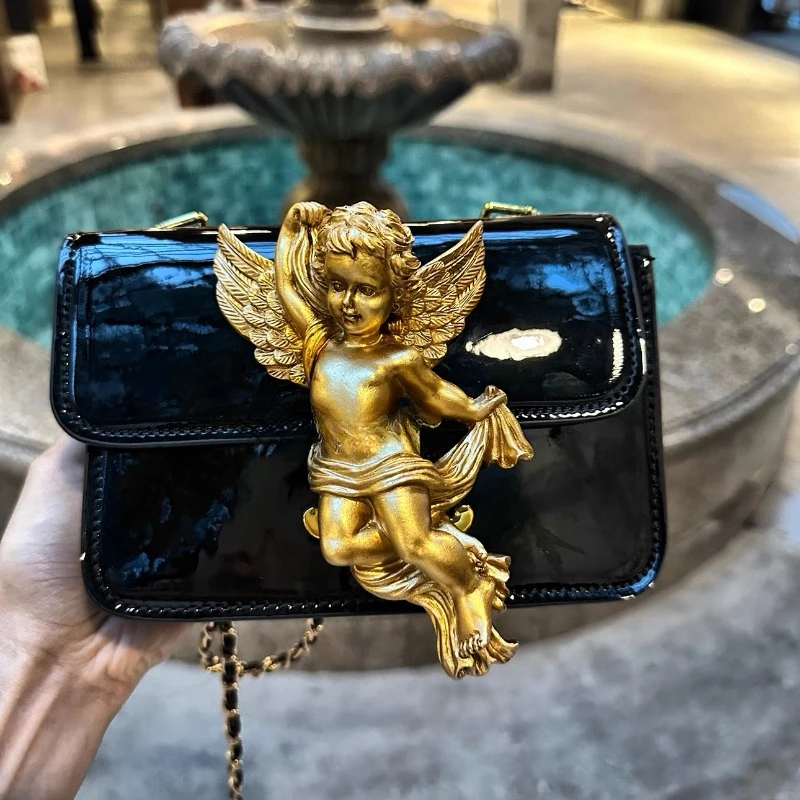 Designer artistic creativity handmade resin angel patent leather small square bag retro bag single shoulder diagonal hanging bag
Designer artistic creativity handmade resin angel patent leather small square bag retro bag single shoulder diagonal hanging bag