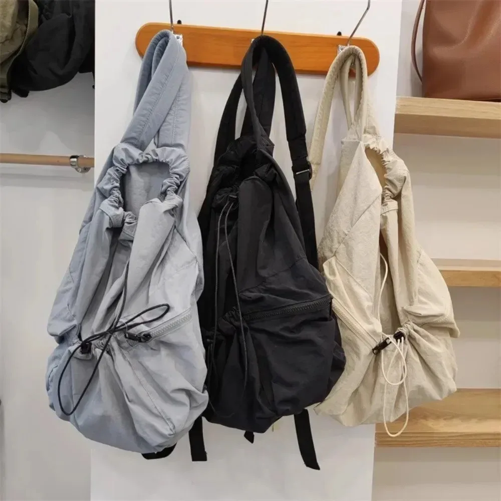2025 Fashion Pleated Drawstring Backpack Women's Casual Nylon Women's Backpack Lightweight Student Bag Large Capacity Travel Bag
2025 Fashion Pleated Drawstring Backpack Women's Casual Nylon Women's Backpack Lightweight Student Bag Large Capacity Travel Bag