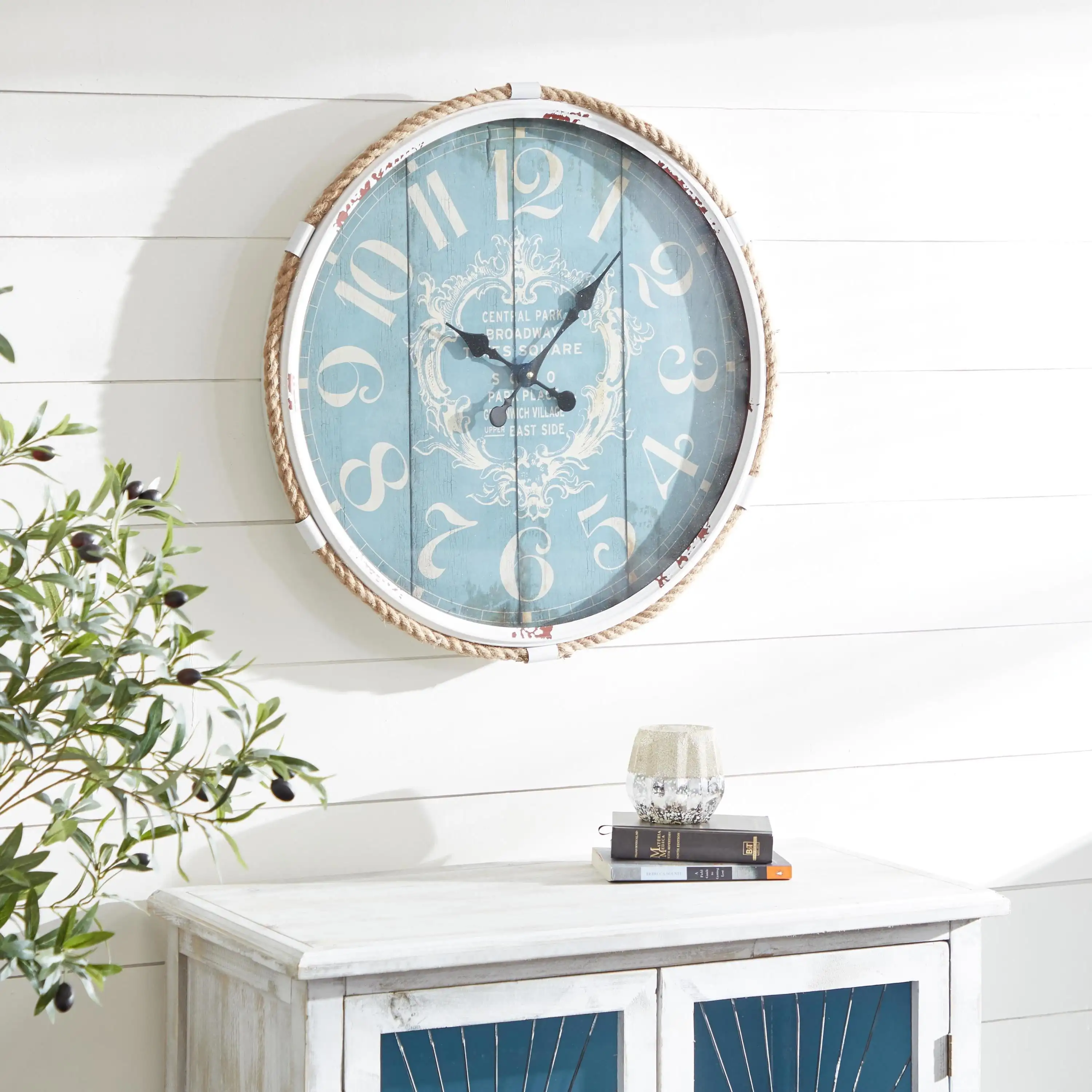 Coastal Turquoise/White Metal Round Wall Clock with Spade Shaped Clock Hands, 25D
Coastal Turquoise/White Metal Round Wall Clock with Spade Shaped Clock Hands, 25D
