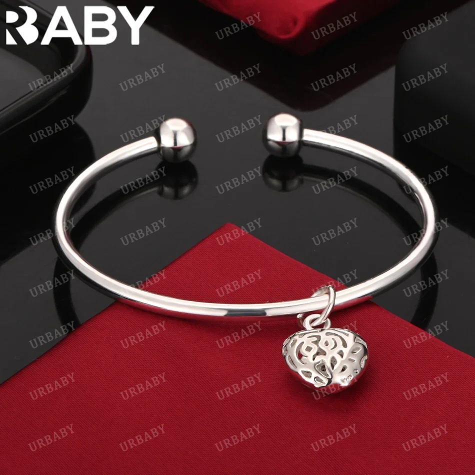 URBABY браслет из стерлингового серебра 925 пробы, глянцевый браслет с полым сердцем для женщин, ювелирные изделия, модная вечеринка и повседневная одежда
URBABY браслет из стерлингового серебра 925 пробы, глянцевый браслет с полым сердцем для женщин, ювелирные изделия, модная вечеринка и повседневная одежда