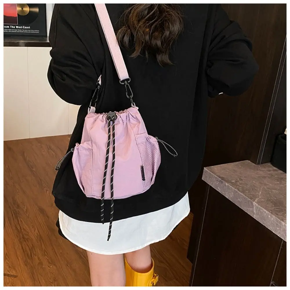 Korean Style Drawstring Bucket Bag Purse Handbag Nylon Shoulder Bag Solid Color Mobile Phone Bag Small Crossbody Bag Outdoor
Korean Style Drawstring Bucket Bag Purse Handbag Nylon Shoulder Bag Solid Color Mobile Phone Bag Small Crossbody Bag Outdoor
