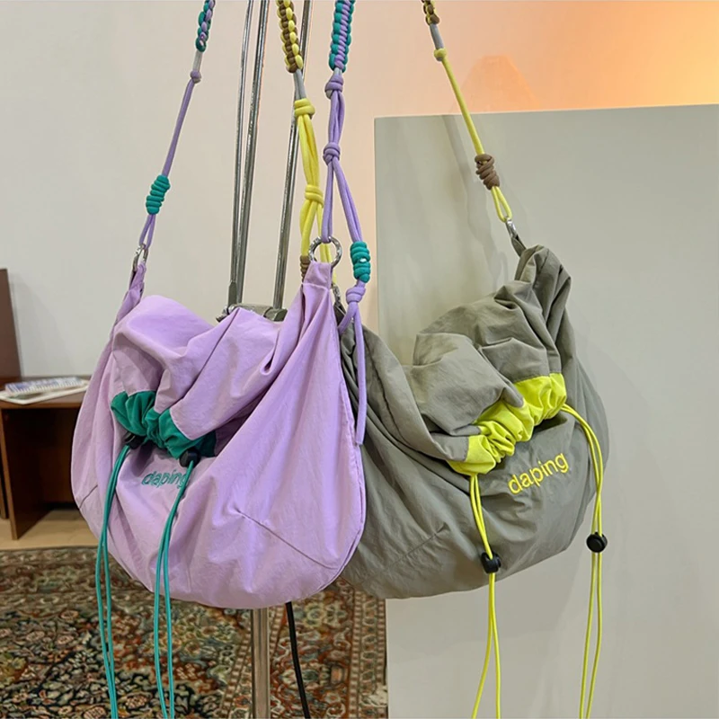 Women's Lightweight Nylon Crossbody Bag Large Capacity Letter Drawstring Bag Shoulder Bag for Girls Leisure Travel & Daily Use
Women's Lightweight Nylon Crossbody Bag Large Capacity Letter Drawstring Bag Shoulder Bag for Girls Leisure Travel & Daily Use