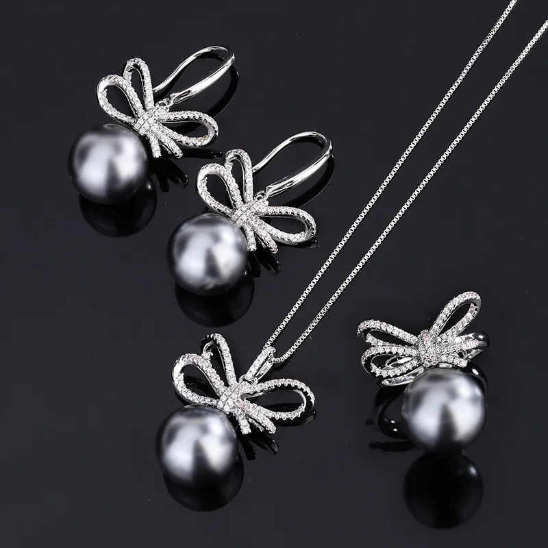 18K Gold Plated PT950 Platinum Gray Shell Beads Fashion Bow Diamond Set for Women 14mm
18K Gold Plated PT950 Platinum Gray Shell Beads Fashion Bow Diamond Set for Women 14mm