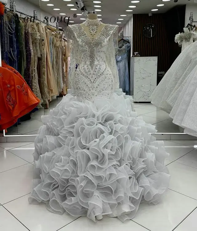 Великолепные оборки Русалка Свадебные вечерние платья Арабский блеск Кристаллы с кисточками Роскошные обручальные платья по индивидуальному заказу 2026
Великолепные оборки Русалка Свадебные вечерние платья Арабский блеск Кристаллы с кисточками Роскошные обручальные платья по индивидуальному заказу 2026