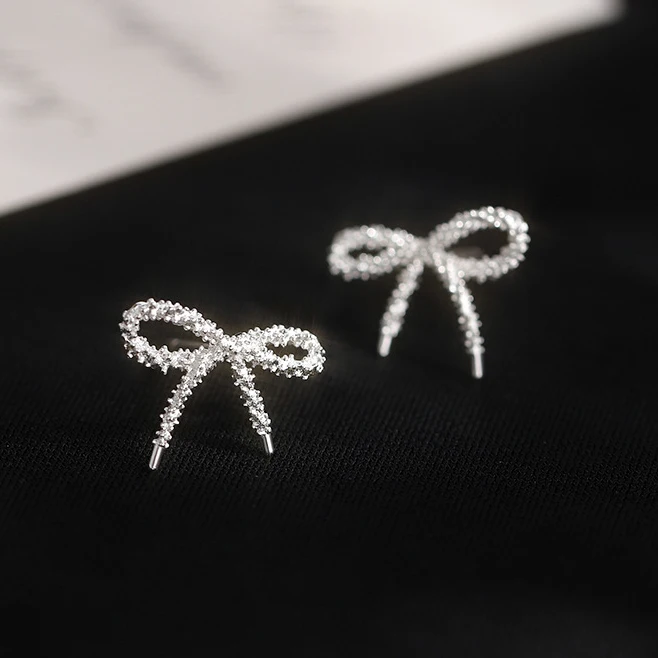 PONYKISS 925 Sterling Silver Mini Shining Hollow Bowknot Stud Earrings for Women Minimalist Fine Jewelry Cute Accessories
PONYKISS 925 Sterling Silver Mini Shining Hollow Bowknot Stud Earrings for Women Minimalist Fine Jewelry Cute Accessories