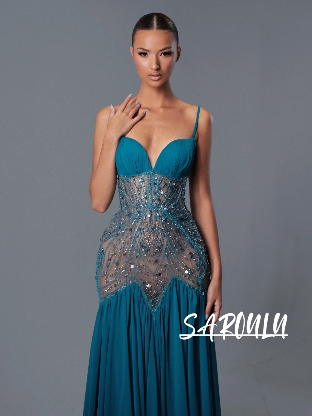 Chic Deep V Neck Teal Prom Dress Women 2026 Crystal Embellished Illusion Waist Spaghetti Strap Chiffon Floor Length Mermaid Gown
Chic Deep V Neck Teal Prom Dress Women 2026 Crystal Embellished Illusion Waist Spaghetti Strap Chiffon Floor Length Mermaid Gown