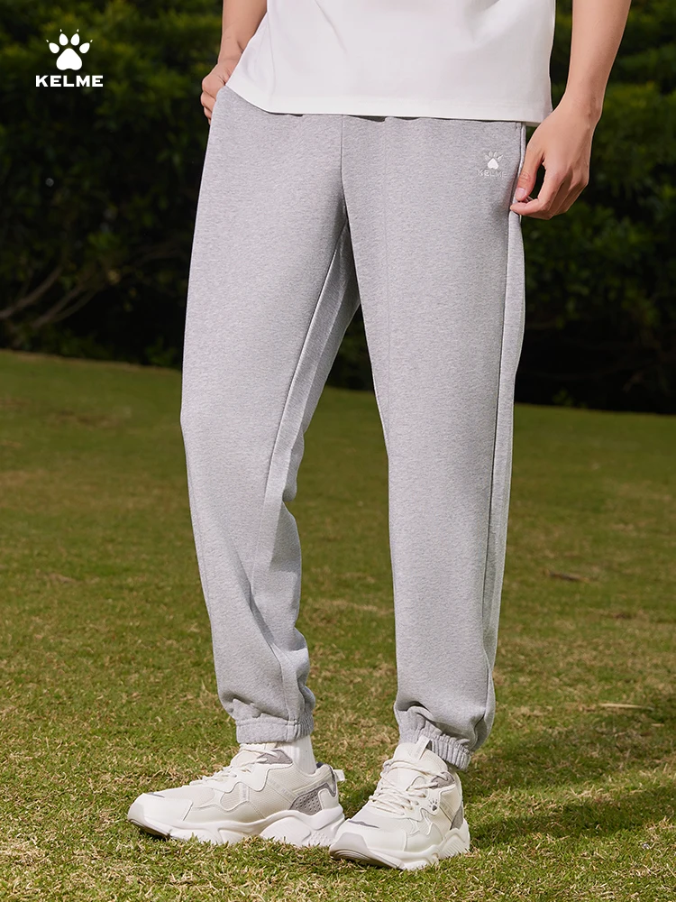 Kelme Men's Sports Trousers Outdoor Running Pants With Cuffs Student Uniform Loose Football Straight Sweatpants
Kelme Men's Sports Trousers Outdoor Running Pants With Cuffs Student Uniform Loose Football Straight Sweatpants