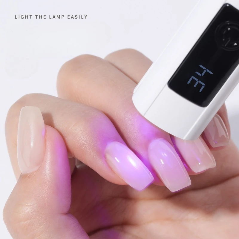 Новинка, 1 шт., быстросохнущая цифровая лампа для фототерапии ногтей с одним персонажем, ручной экранный дисплей, портативная лампа для ногтей с синим светом
Новинка, 1 шт., быстросохнущая цифровая лампа для фототерапии ногтей с одним персонажем, ручной экранный дисплей, портативная лампа для ногтей с синим светом