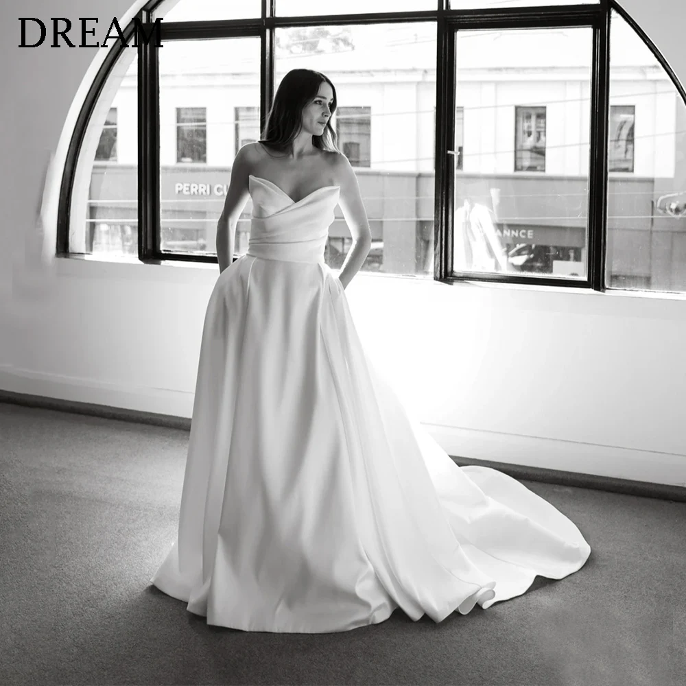 Customized Simple Long Wedding Dresses for Women Ivory V-Neck Backless Floor-Length Sweep Train Bridal Dress Wedding Gown 2025
Customized Simple Long Wedding Dresses for Women Ivory V-Neck Backless Floor-Length Sweep Train Bridal Dress Wedding Gown 2025