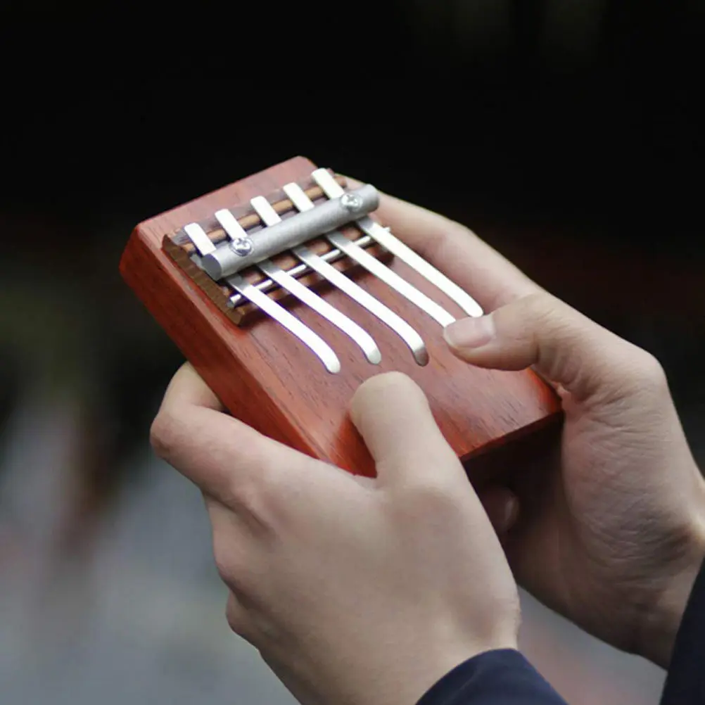 1Pcs Premium Thumb Piano 5-Tone Kalimba Portable Finger Piano for Beginners Natural Wood and Aluminum Body Reddish Brown Tone
1Pcs Premium Thumb Piano 5-Tone Kalimba Portable Finger Piano for Beginners Natural Wood and Aluminum Body Reddish Brown Tone