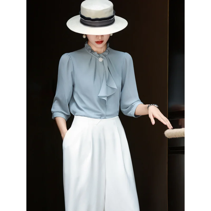 MEXCOCO 2026 Summer New French Ruffled Collar Shirt Women Loose Slim Fit Blouse
MEXCOCO 2026 Summer New French Ruffled Collar Shirt Women Loose Slim Fit Blouse