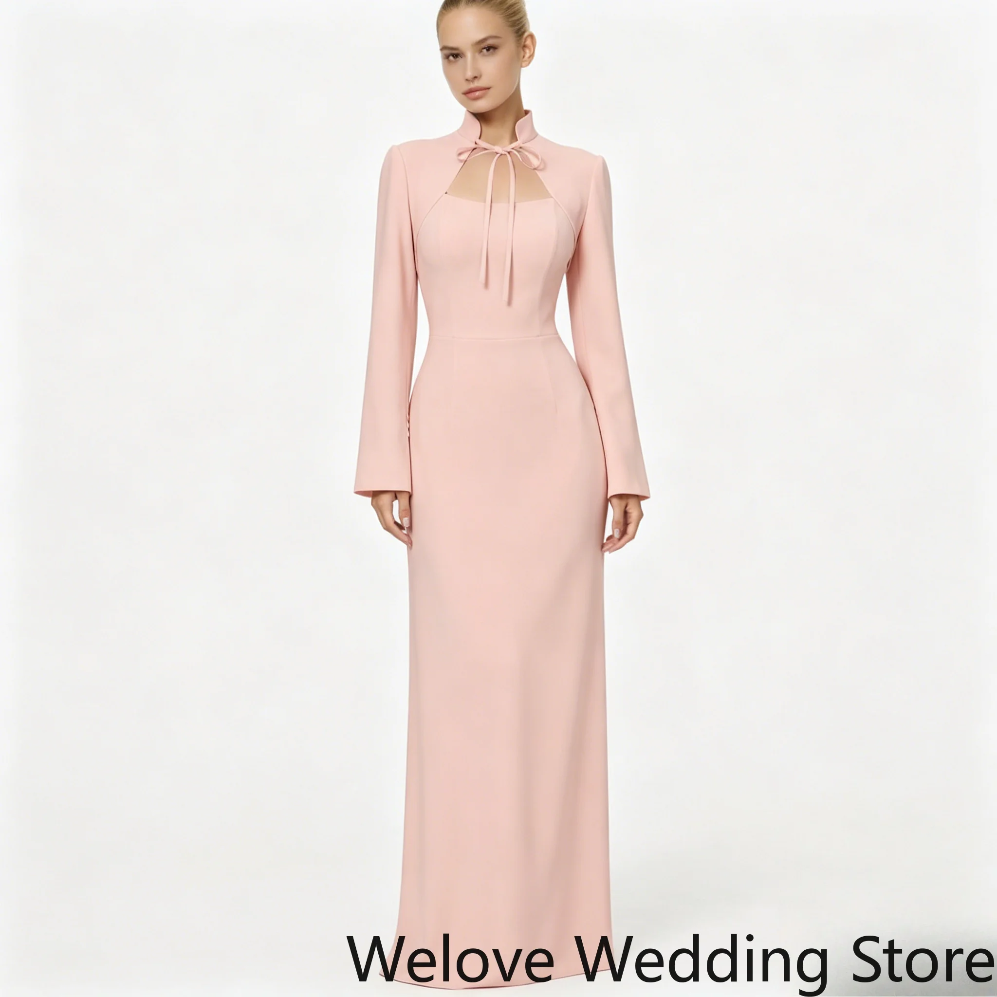 Blush Pink Formal Evening Gown Featuring Mandarin Collar with Keyhole Neck and Bow Tie Detail, Long Flared Sleeves
Blush Pink Formal Evening Gown Featuring Mandarin Collar with Keyhole Neck and Bow Tie Detail, Long Flared Sleeves