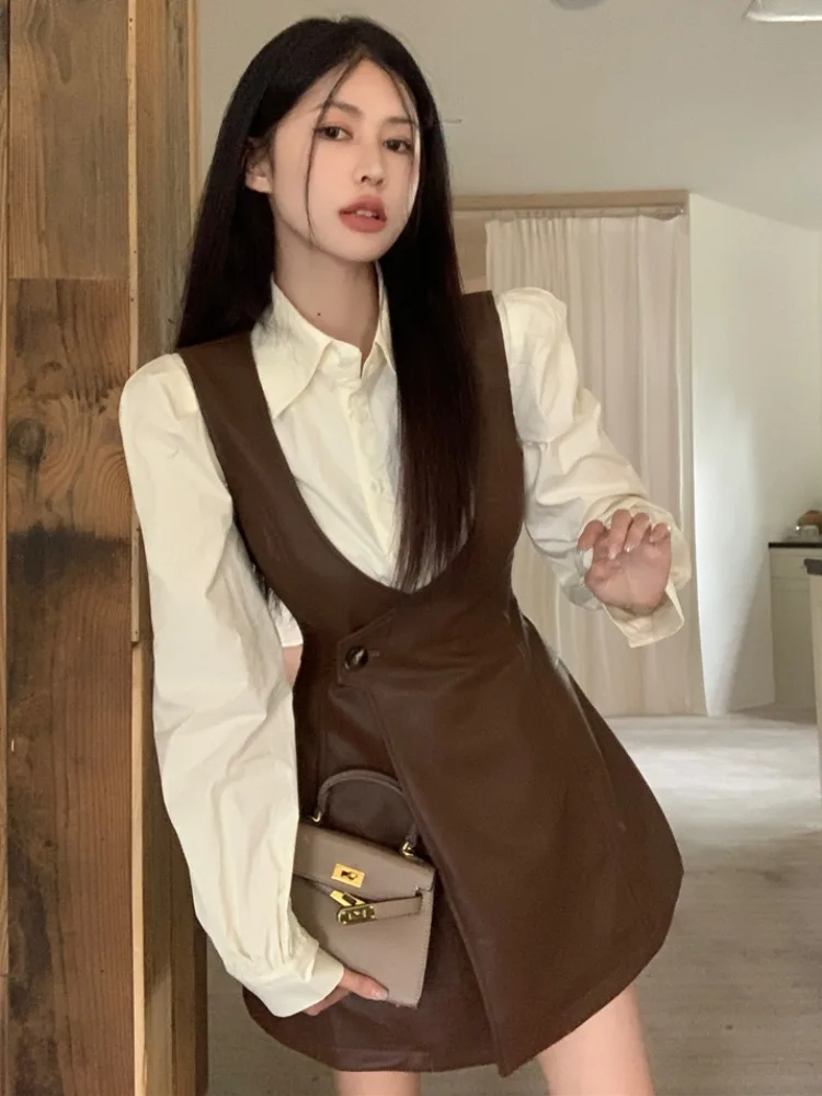 Korean Fashion White Shirt Bubble Sleeve V-Neck PU Leather Belted Short Skirt Two-Piece Set Women's Autumn Design Unique Style
Korean Fashion White Shirt Bubble Sleeve V-Neck PU Leather Belted Short Skirt Two-Piece Set Women's Autumn Design Unique Style