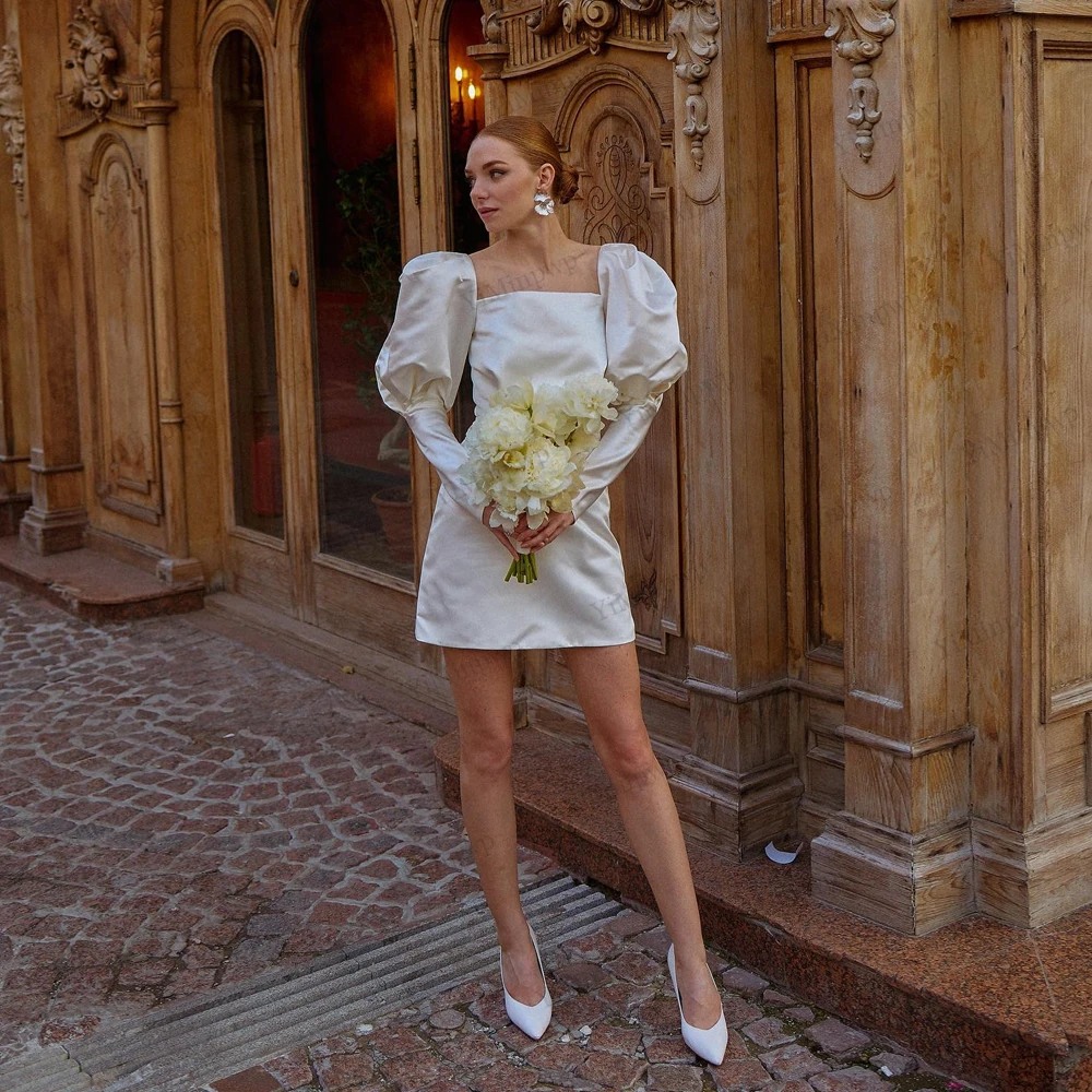 Customized Long Bubble Sleeves Satin Micro Wedding Dress Simple Square Neck Above Knee Mini Length Retro Bridal Gowns 2026
Customized Long Bubble Sleeves Satin Micro Wedding Dress Simple Square Neck Above Knee Mini Length Retro Bridal Gowns 2026