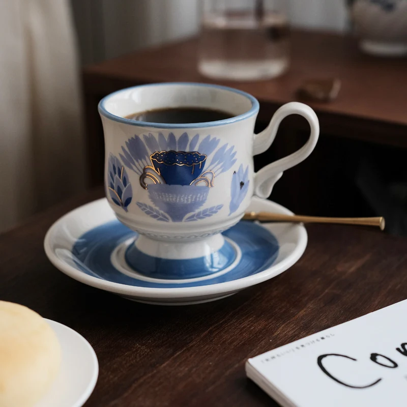 Medieval Blue Tropical Flowers and Fruits with Golden Embellishments, Ceramic High Legged Coffee Cups and Plates
Medieval Blue Tropical Flowers and Fruits with Golden Embellishments, Ceramic High Legged Coffee Cups and Plates