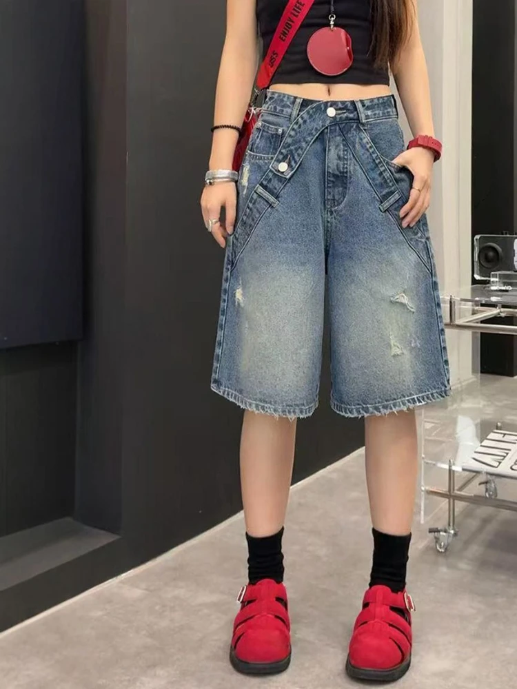 Broken hole denim shorts women summer 2026 new design sense fashionable street versatile wide leg five quarter pants
Broken hole denim shorts women summer 2026 new design sense fashionable street versatile wide leg five quarter pants