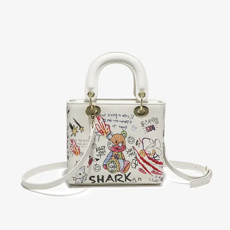2024 New Cartoon Bear Graffiti High end Feeling Bag Women's Versatile Trendy Handheld One Shoulder Crossbody Bag Women's Bag
2024 New Cartoon Bear Graffiti High end Feeling Bag Women's Versatile Trendy Handheld One Shoulder Crossbody Bag Women's Bag